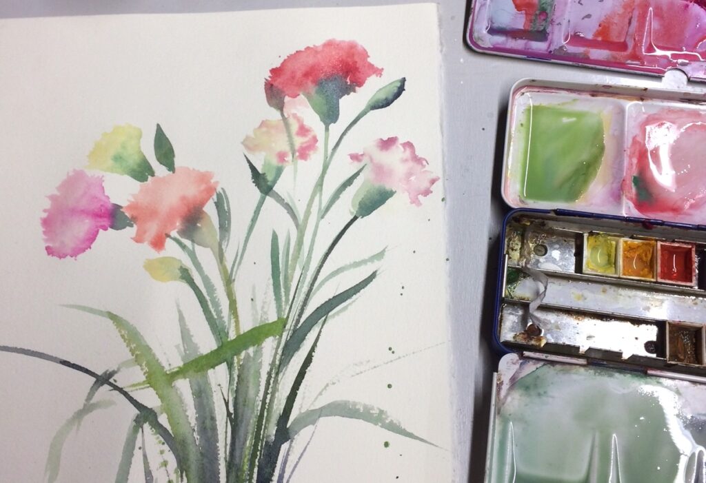 Fleurs à l'aquarelle avec boîte de peinture